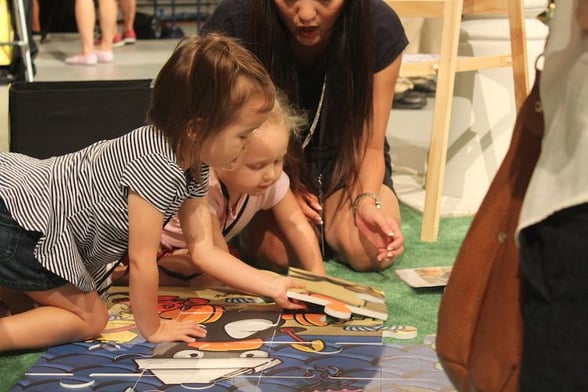 early learners solve puzzles at the math fair